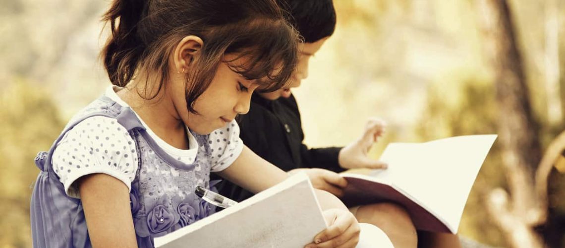 Village Girl and boy studying outdoor