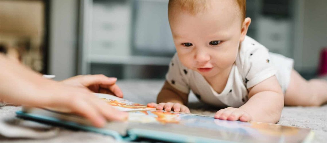 Infant reading a book