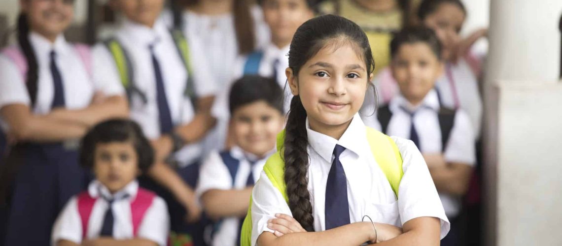 Group of Indian schoolboys and schoolgirls at school campus